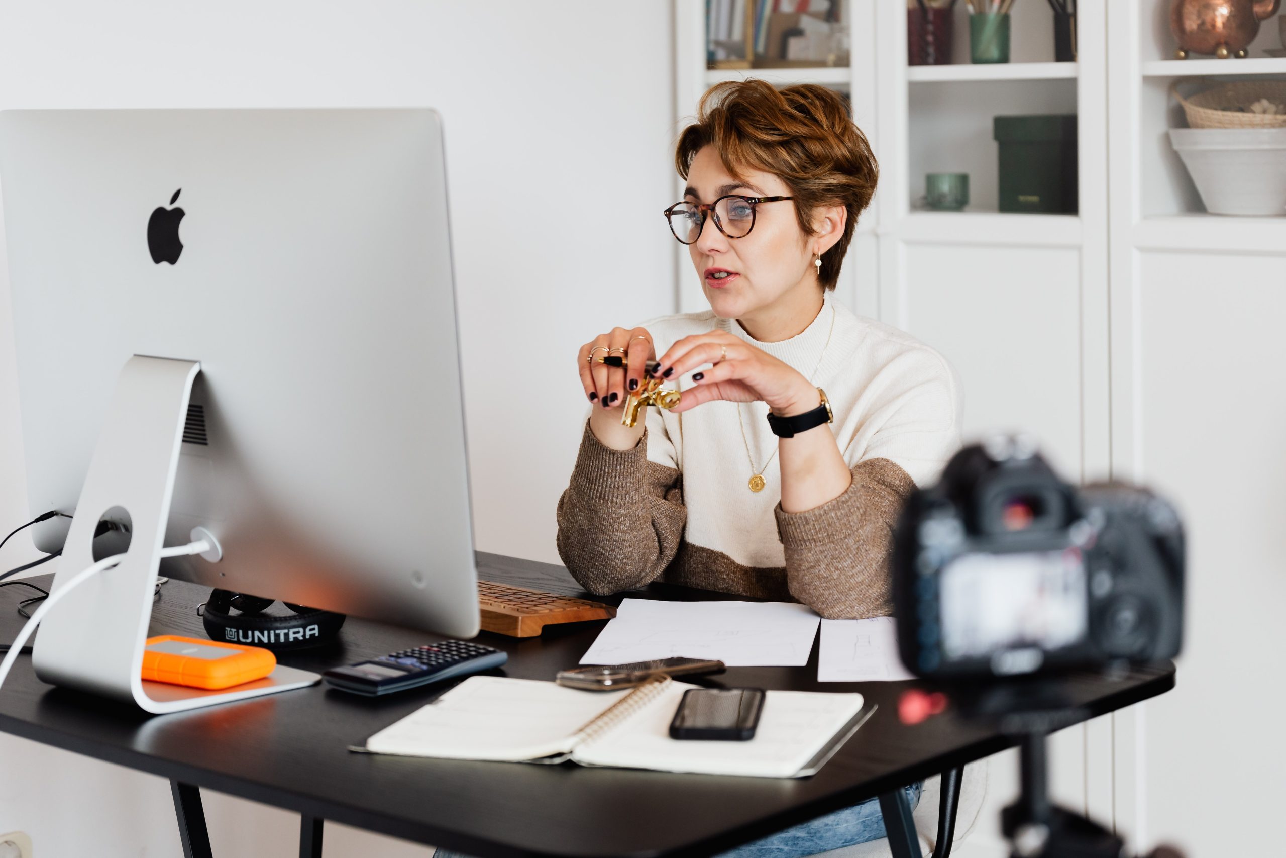 women recording video in work office